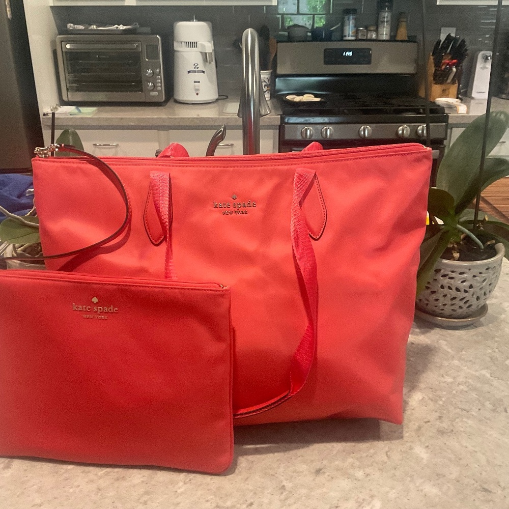 Kate Spade tote with small cosmetic bag attache. Pink nylon